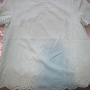 Green shirt with flower cut outs